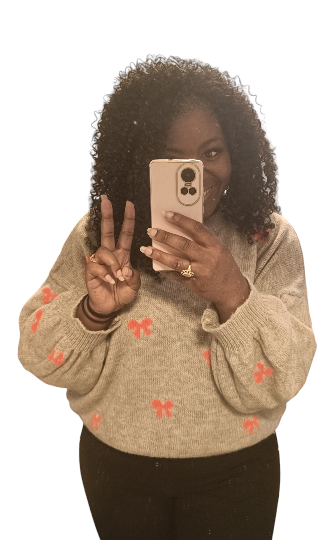 Taupe kleurige trui met oranje strikjes