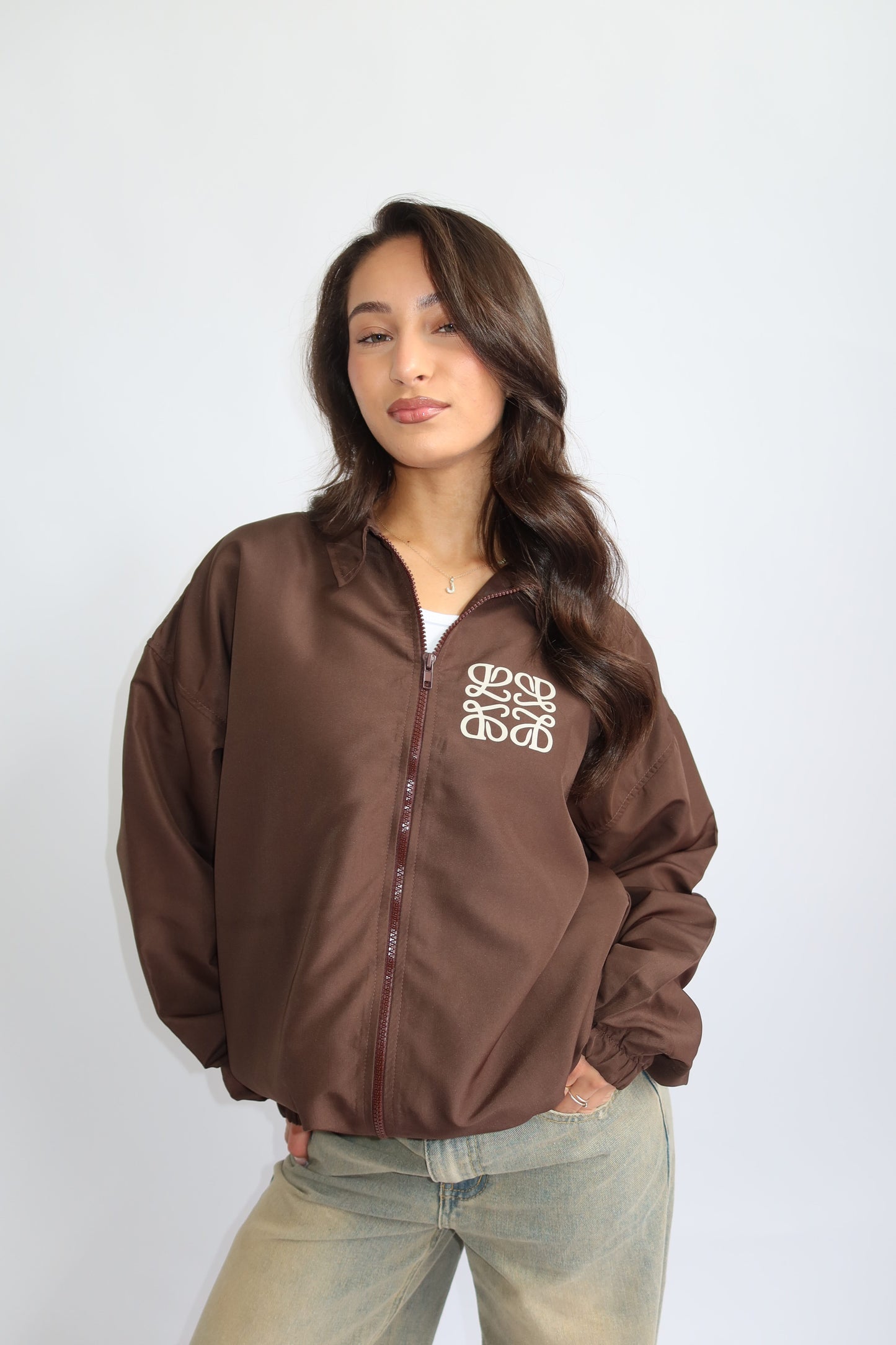Priority jack; Priority monogram wind jacket - Bruin