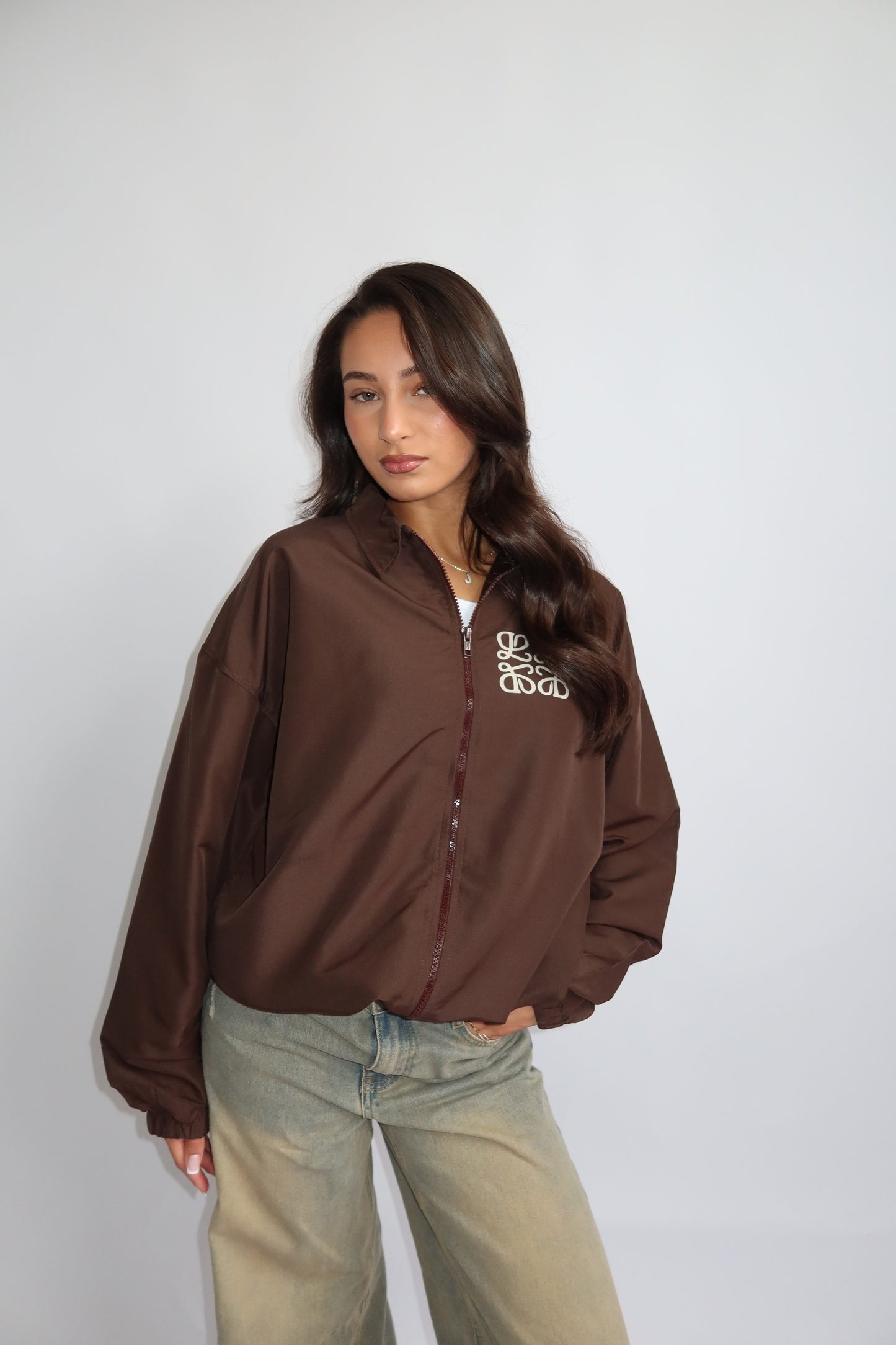 Priority jack; Priority monogram wind jacket - Bruin