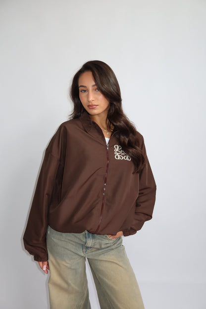 Priority jack; Priority monogram wind jacket - Bruin