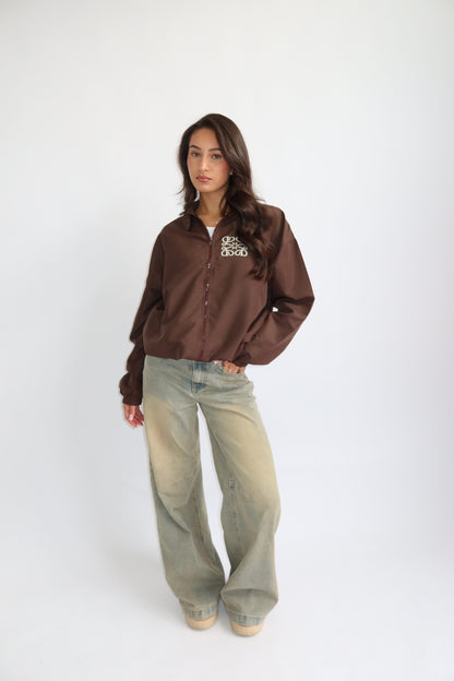 Priority jack; Priority monogram wind jacket - Bruin