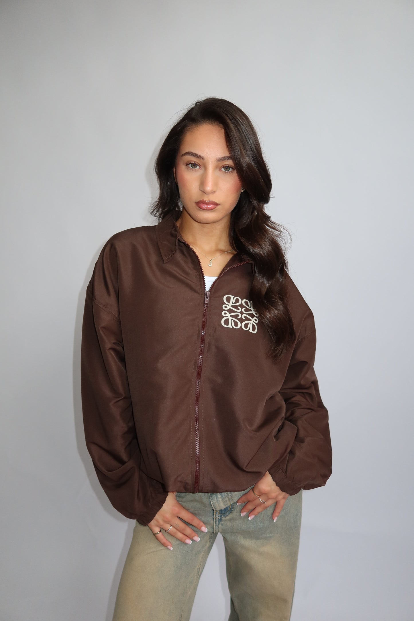 Priority jack; Priority monogram wind jacket - Bruin