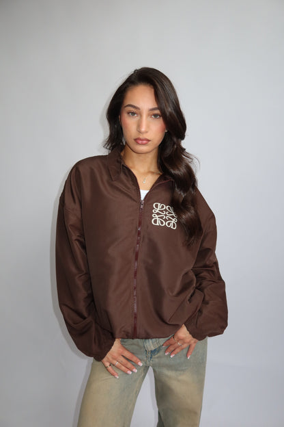 Priority jack; Priority monogram wind jacket - Bruin